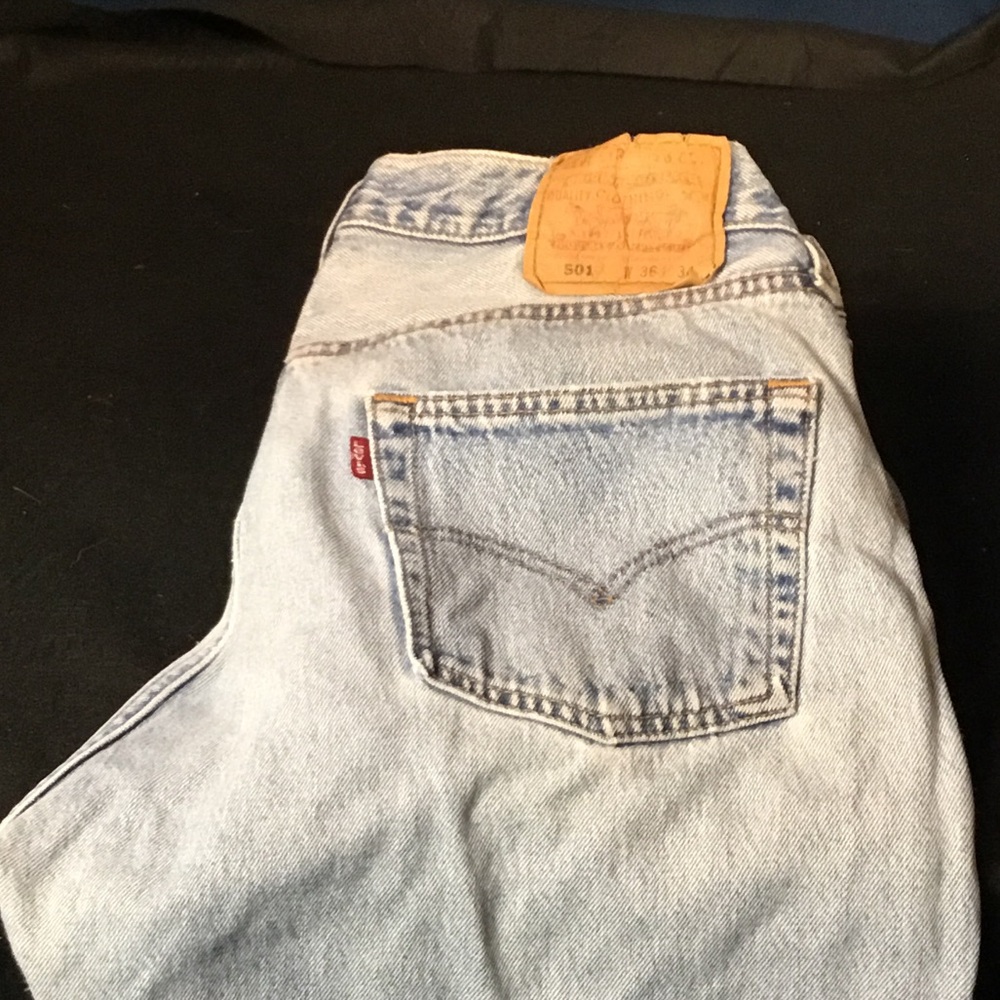 Levi's 501 worn faded blue jeans.
36 x 34.